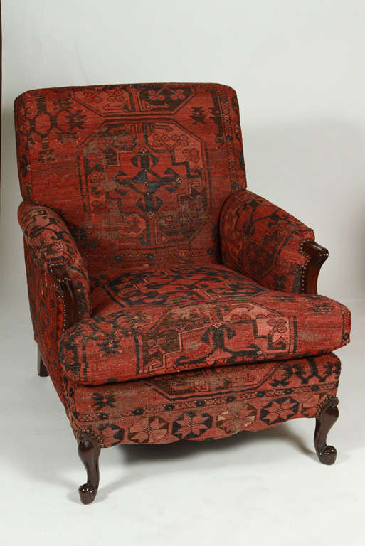 Antique French club chair completely redone. Wood refinished and upholstery in vintage flat weave red wool rug with nail heads.