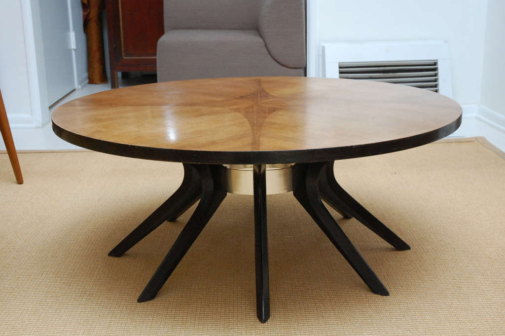 From Broyhill’s Brasilia collection of the 1960s, the black, sculptural legs are mounted to the stainless steel accent piece in the center and the top features a lovely, decorative walnut inlay. 