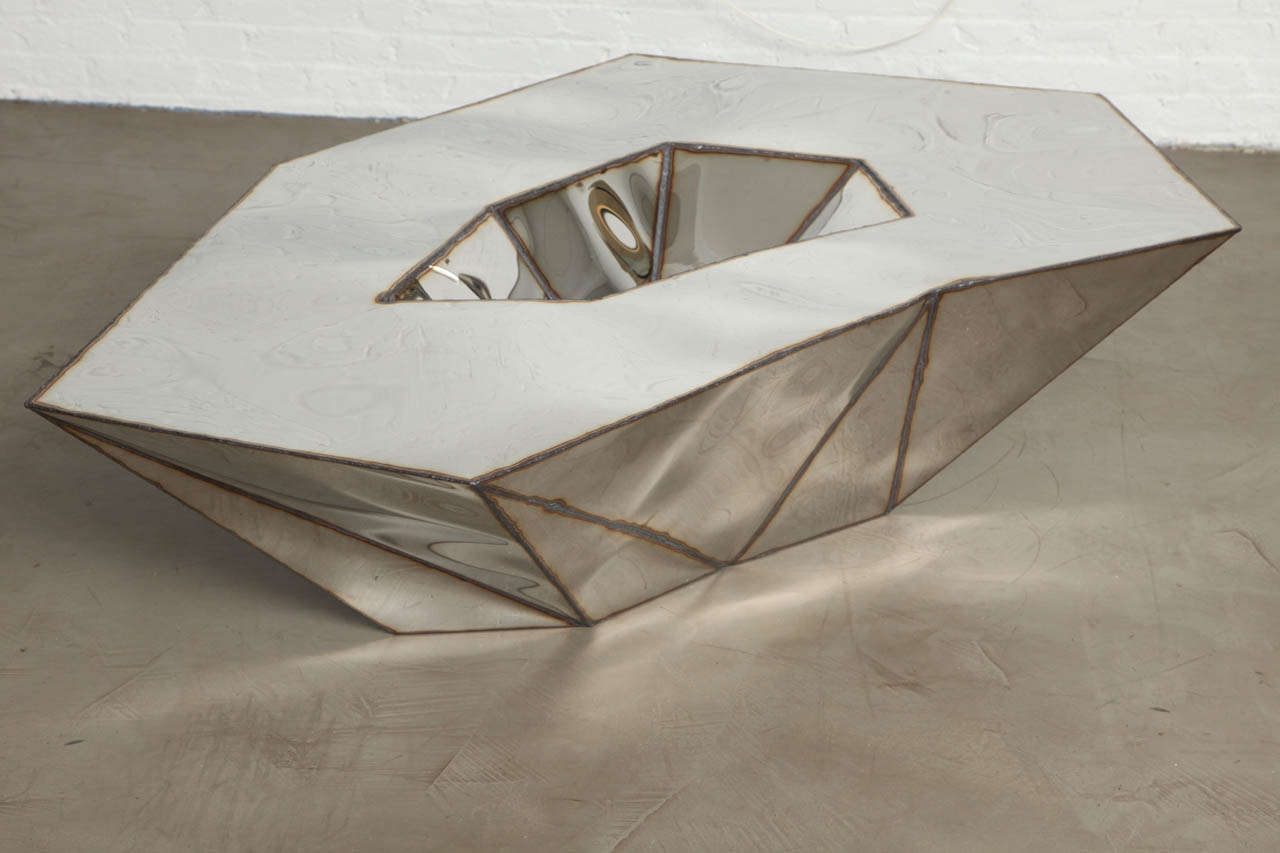 Mirror finished, stainless steel coffee table.

Limited Edition of 12.
2013.

Julian Mayor is an artist and designer based in East London. His work is inspired by the sculptural possibilities of computers combined with Industrial and craft making