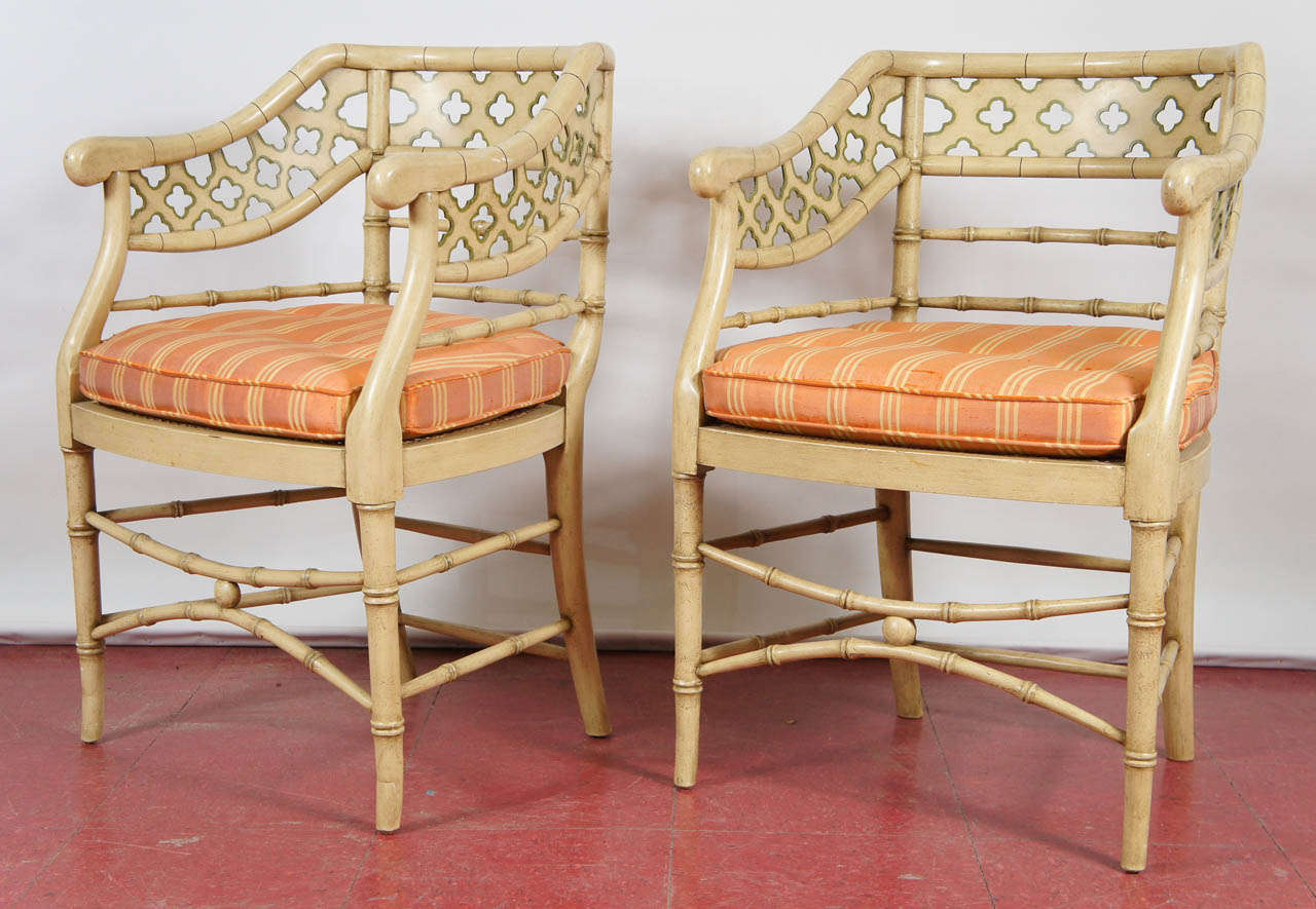 These chairs are full of style with cream painted wood, faux bamboo stretchers, quatre-foil pierced backs outlined in green, woven wicker seats and salmon-stripped, slubbed-silk, custom-fitted cushions.  They are great for extra seating in the