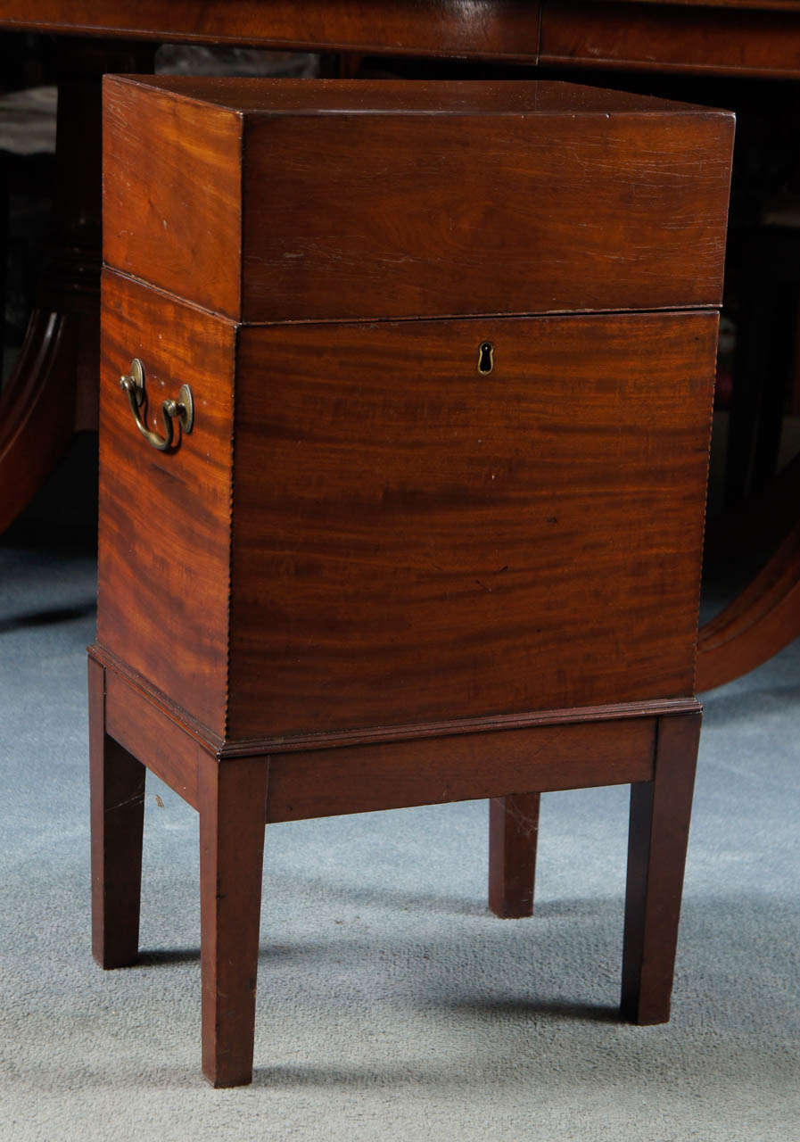 A diminutive cellarette in warm mahogany with original fittings serves many functions. The first is to hold liquor bottles but also acts as a base or display stand for a treasured vase or sculpture. The clean lines and great proportions allows it to