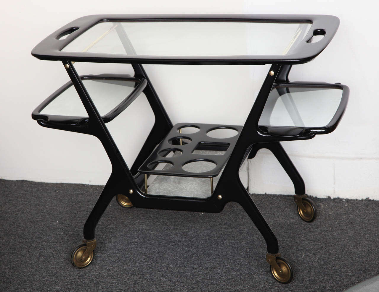 STYLISH BAR / SERVING CART DESIGNED By C.LACCA MADE IN MILAN 1955, UNUSUAL FORM THAT IT HAS 2 SMALL AND I LARGE SERVING TRAYS WITH RACK ON BOTTOM FOR BOTTLES, GREAT DESIGN.