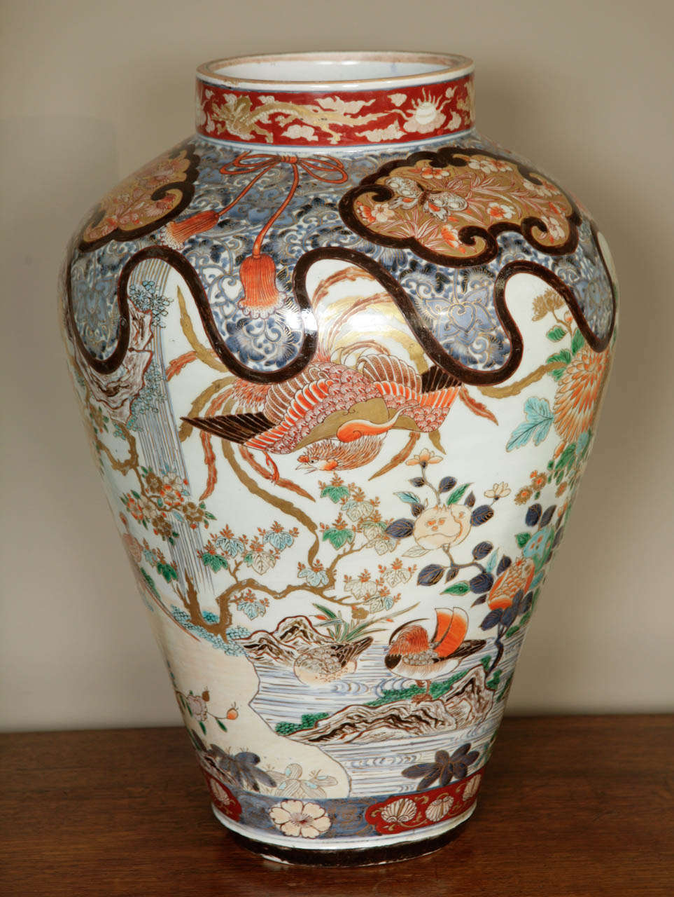 A spectacular and huge early 18th century Japanese Imari vase, circa 1700 showing a plethora of exotic birds such as ducks, pheasants, phoenixes and birds of paradise. All set in a landscape with waterfalls, ponds and rocks. Decorated throughout