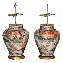 17th Century Pair of Imari Baluster Vases on Giltwood Bases