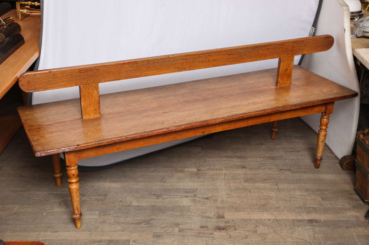 English Antique Bench with turned legs and finely crafted details. Two sided design is unusual. 

Handpicked by buyers at Ann-Morris, Inc.