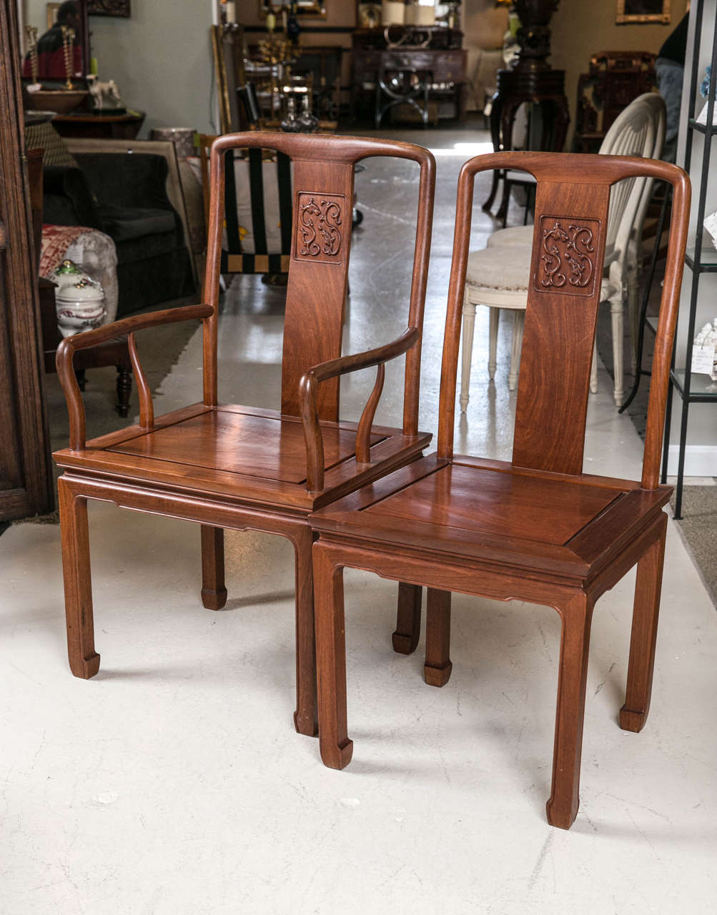 12 campherwood dining chairs Early mid 20th c. to include two arm chairs + 10 side chairs each with carved splat.  Provenance from Seitz family owners of Shanghai Lumber Co.