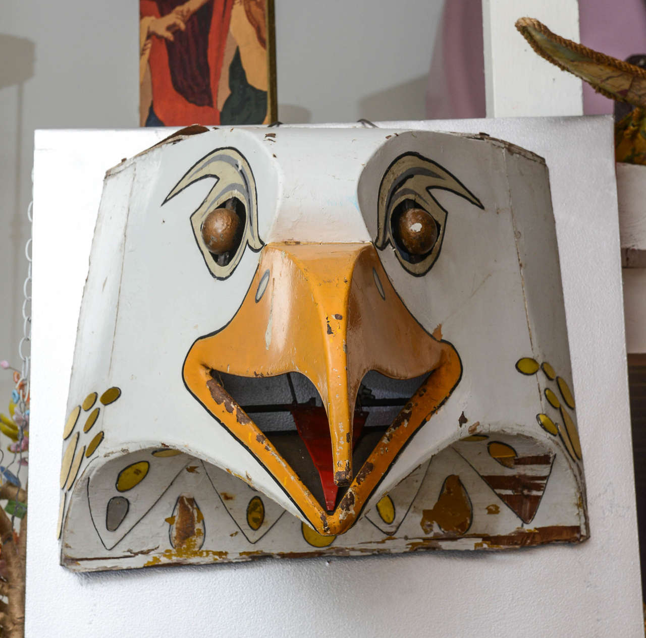 One of a kind painted metal and wood eagle head from a 1940s carnival. Has mirror accents around neck.