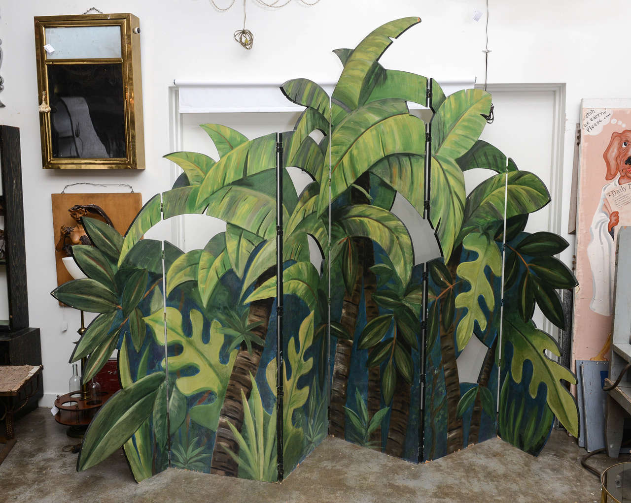 Fantastic hand painted, six paneled wooden cut out screen. Painted on both sides with tropical foliage. Perfect for home or commercial space. Very decorative.