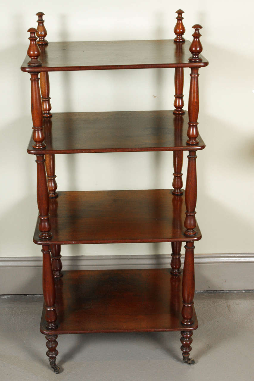 An English Regency mahogany étagère with four tiers, early 19th century.