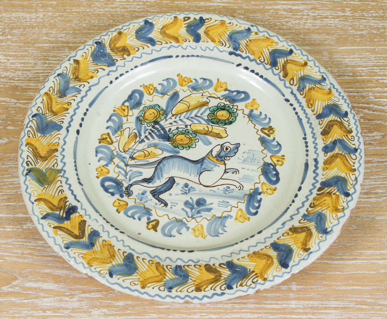 A Spanish Polychrome Faience Charger with a charming Dog Motif, c. 1820