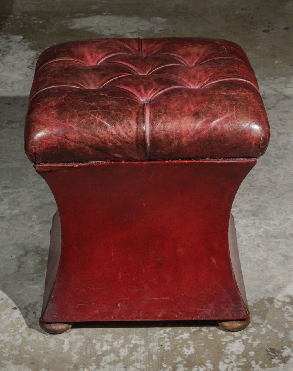 19th century English red leather upholstered leather ottoman. 