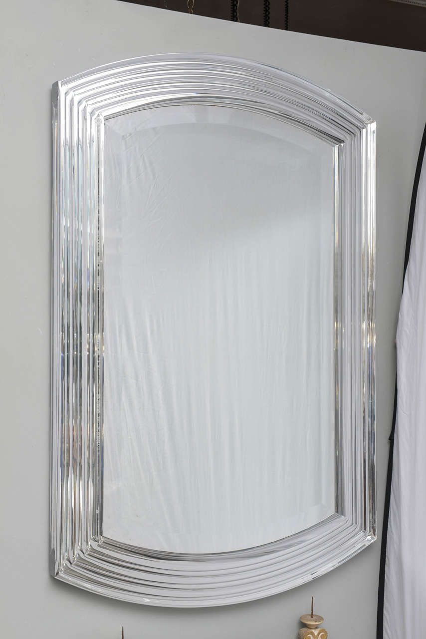 Large Lucite mirror with soft curved profile.