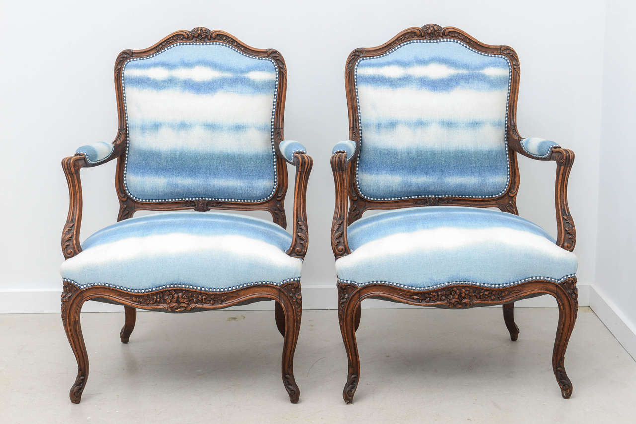 Pair of bergères with sky blue ombre fabric and nailhead detail.