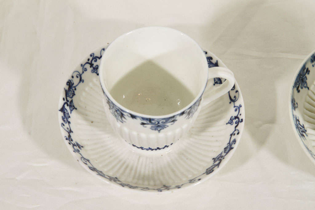 blue and white cups and saucers