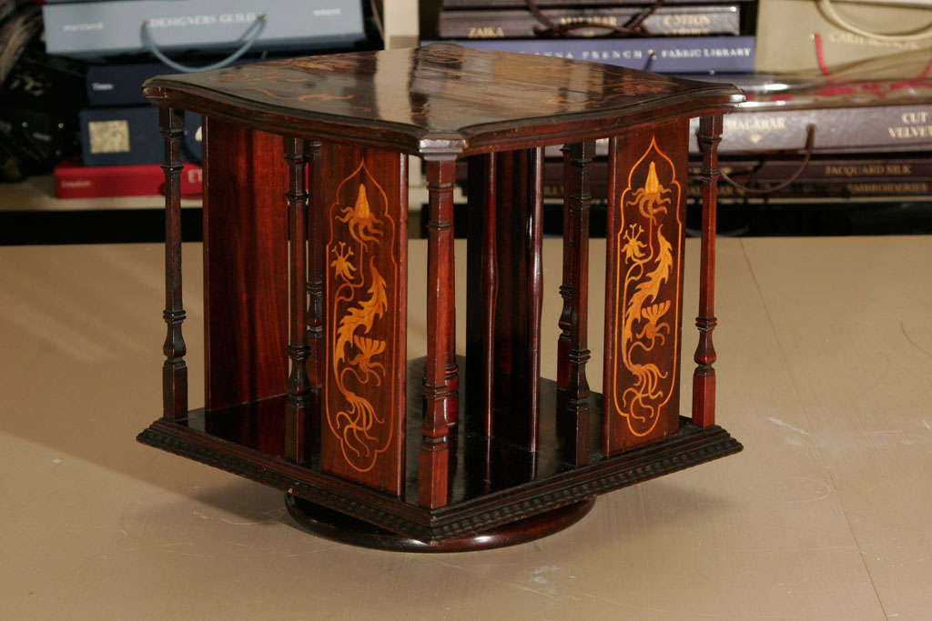 A Shapland & Petter inlaid red Walnut table top revolving Bookcase. Decorated with satinwood inlay of scrolling foliage in an Art Nouveau manner.
Stamped number “113” to base.
Lit; For a similar example of Shapland and Petter, see plate 253, p236.