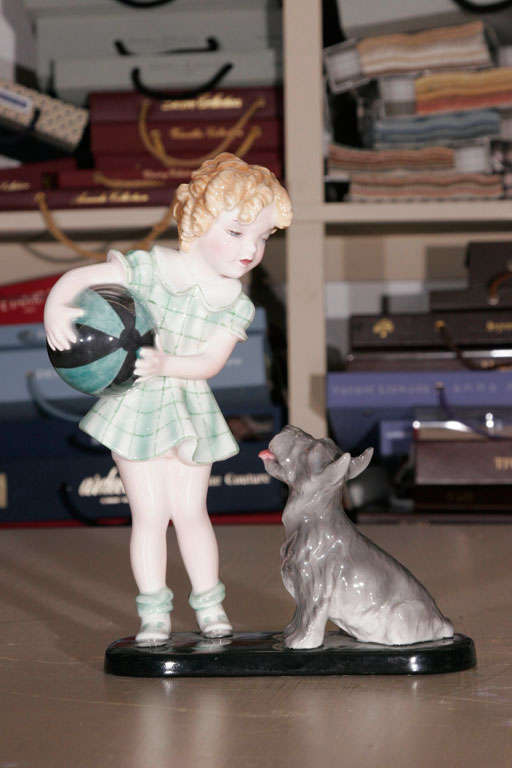 A Goldscheider Figure of a Girl with a terrier