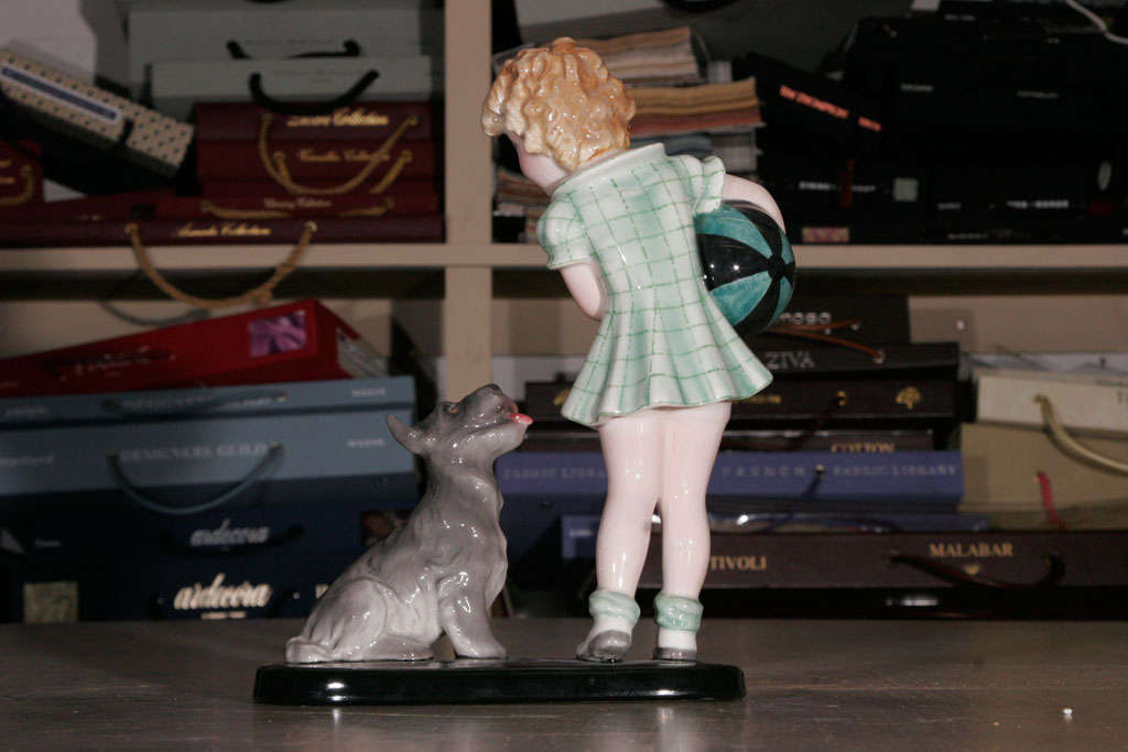 Mid-20th Century A Goldscheider Figure of a Girl with a terrier