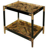 A Two Tier Etagere By Piero Fornasetti.