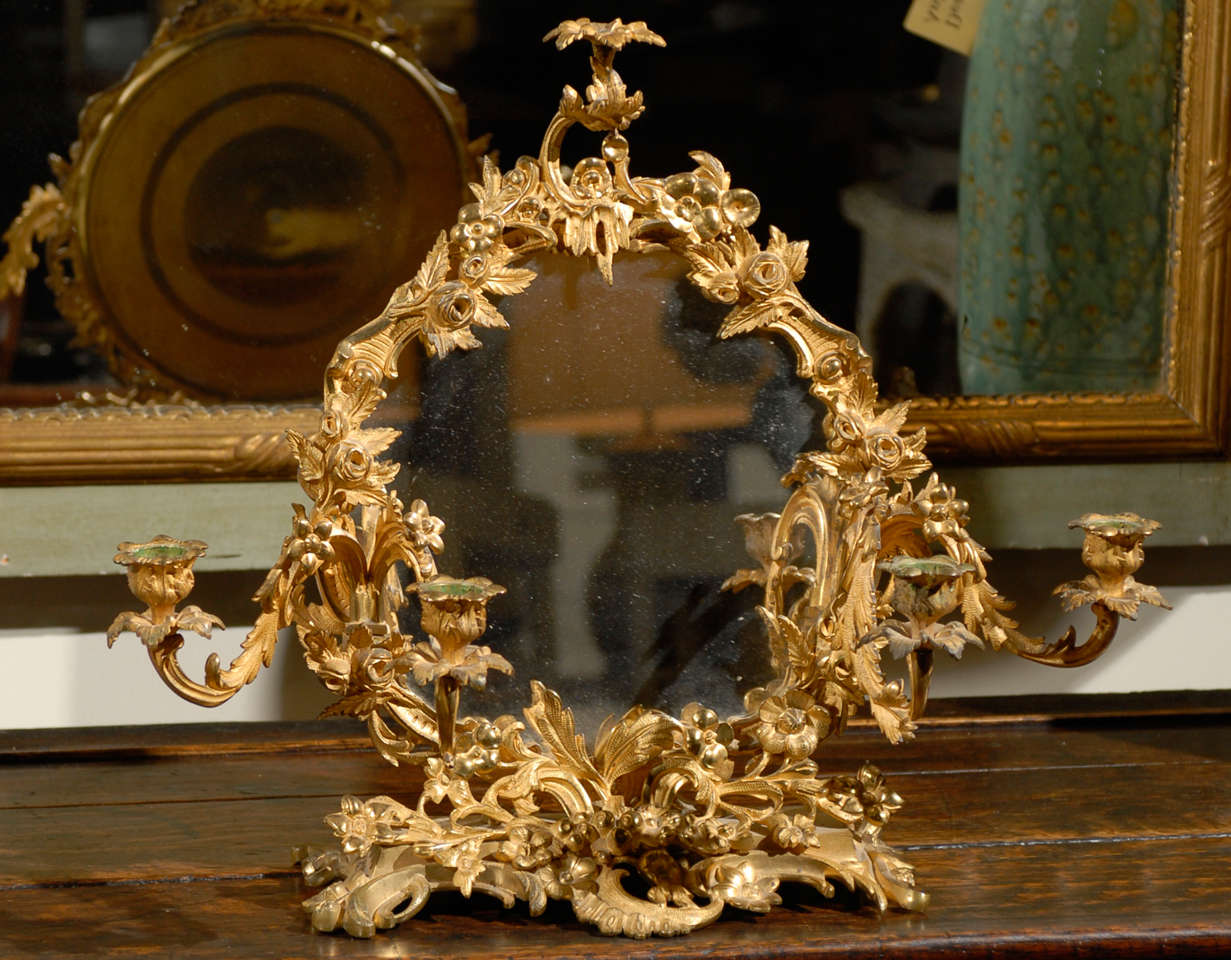This is a beautiful French candelabra and mirror.  The details are stunning.  

  