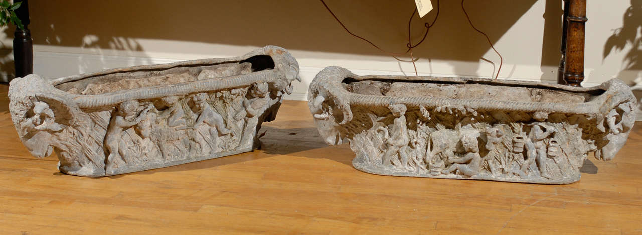 This is a gorgeous pair of cast iron planters believed to have come from Marie Antoinette's farm, L'Hameau de la Reine.  L'Hameau is located on the grounds of Versailles.  It was considered Marie Antoinette's place of escape.  These cast iron