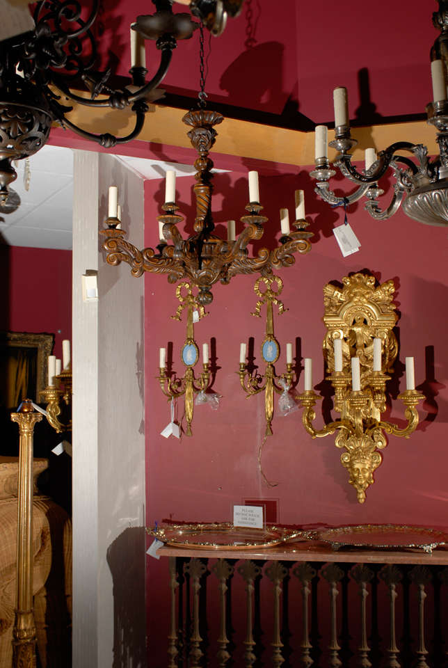Elegantly hand carved wood chandelier with eight arms