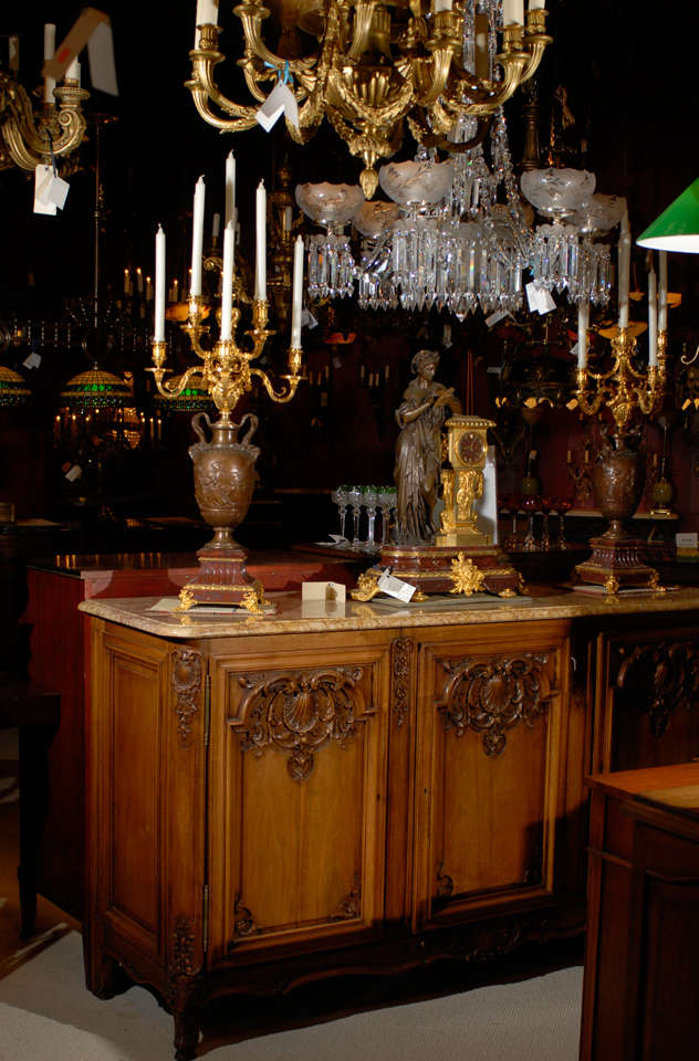 Impressive pair of gilt and patinated bronze candelabra, having eight arms and with neoclassical scenes in relief, with Rouge Griotte bases, signed Barbedienne 