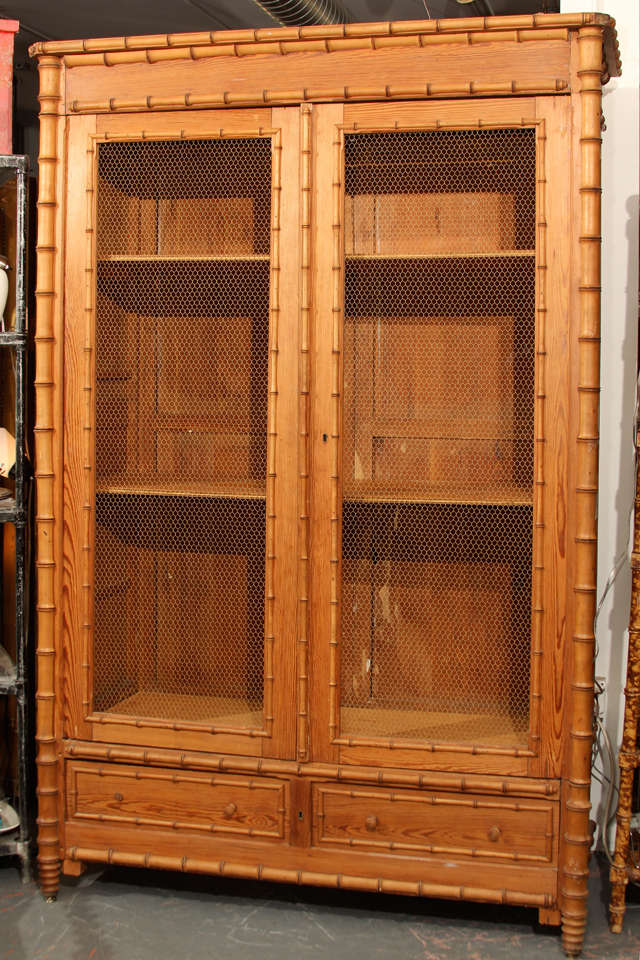 very nice collapsible faux bamboo cabinet with wire mesh doors, and 2 drawers.   New shelves and missing part of one drawer pull. Very sturdy