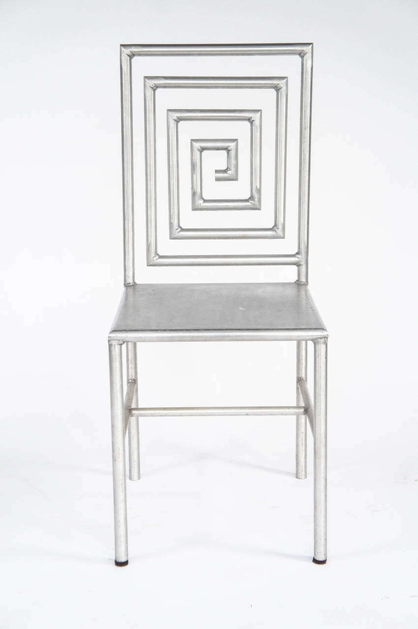 One of a kind chair created from aluminum tubing a great scale and a wonderful surface.