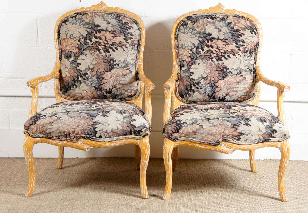 Here is a great pair of faux bois arm chairs upholstered in an Aubusson fabric.