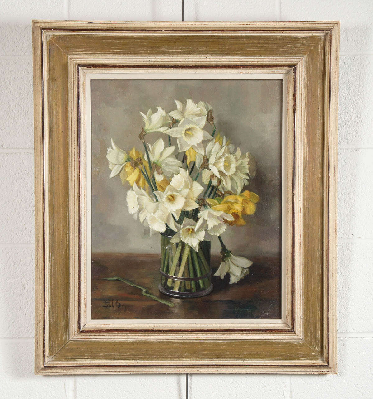 Here is a beautiful still life painting of a bouquet of daffodils in a vintage frame.