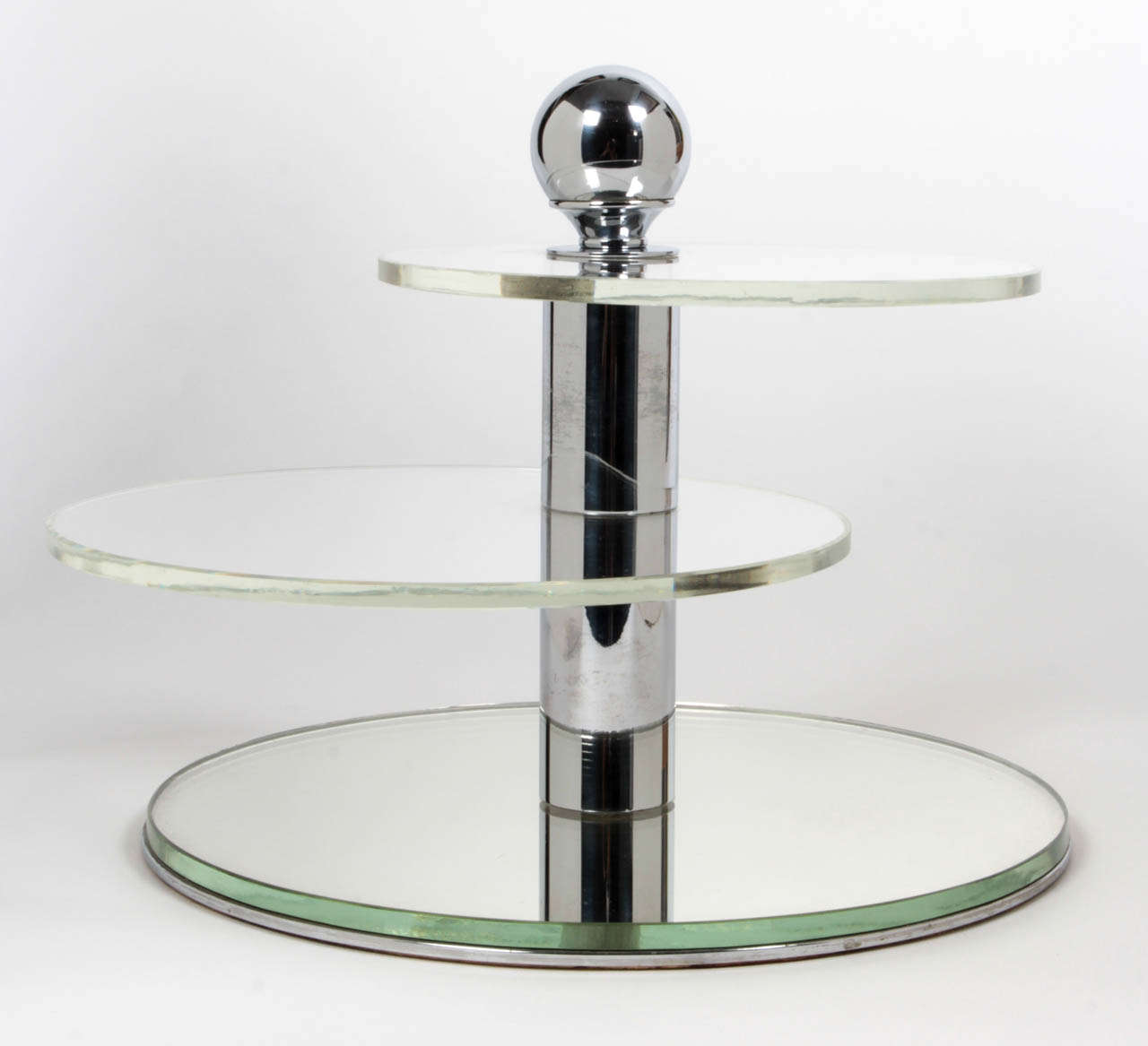 DONALD DESKEY  attributed (1894-1989)  USA
DESKEY-VOLLMER, INC.  (maker)

Modernist intersecting-circles store display  c.1928-30

Chrome-plated sphere and cylindrical shaft and details, original plate glass shelves and mirrored base