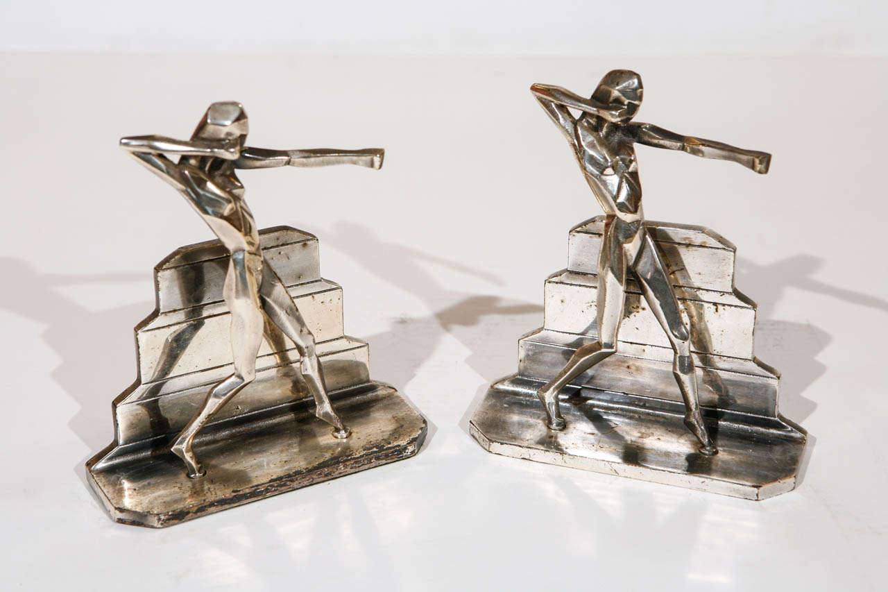 A striking pair of Art Deco bookends in the Cubist style. Made of nickel plated metal.