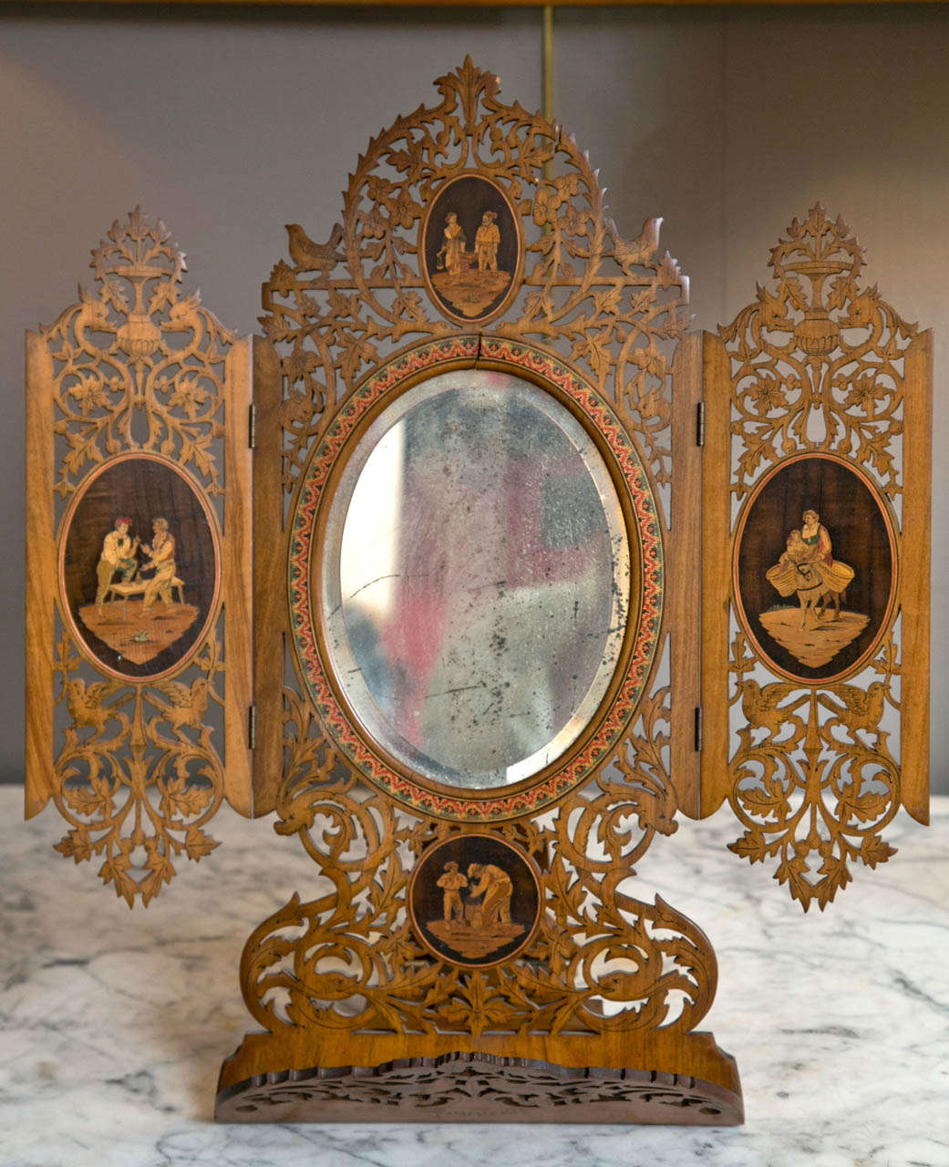 A late 19th Century Italian Sorrento Souvenir Carved Olive-wood and Inlaid in various and exotic woods Table Mirror.

Dimensions, 19.5