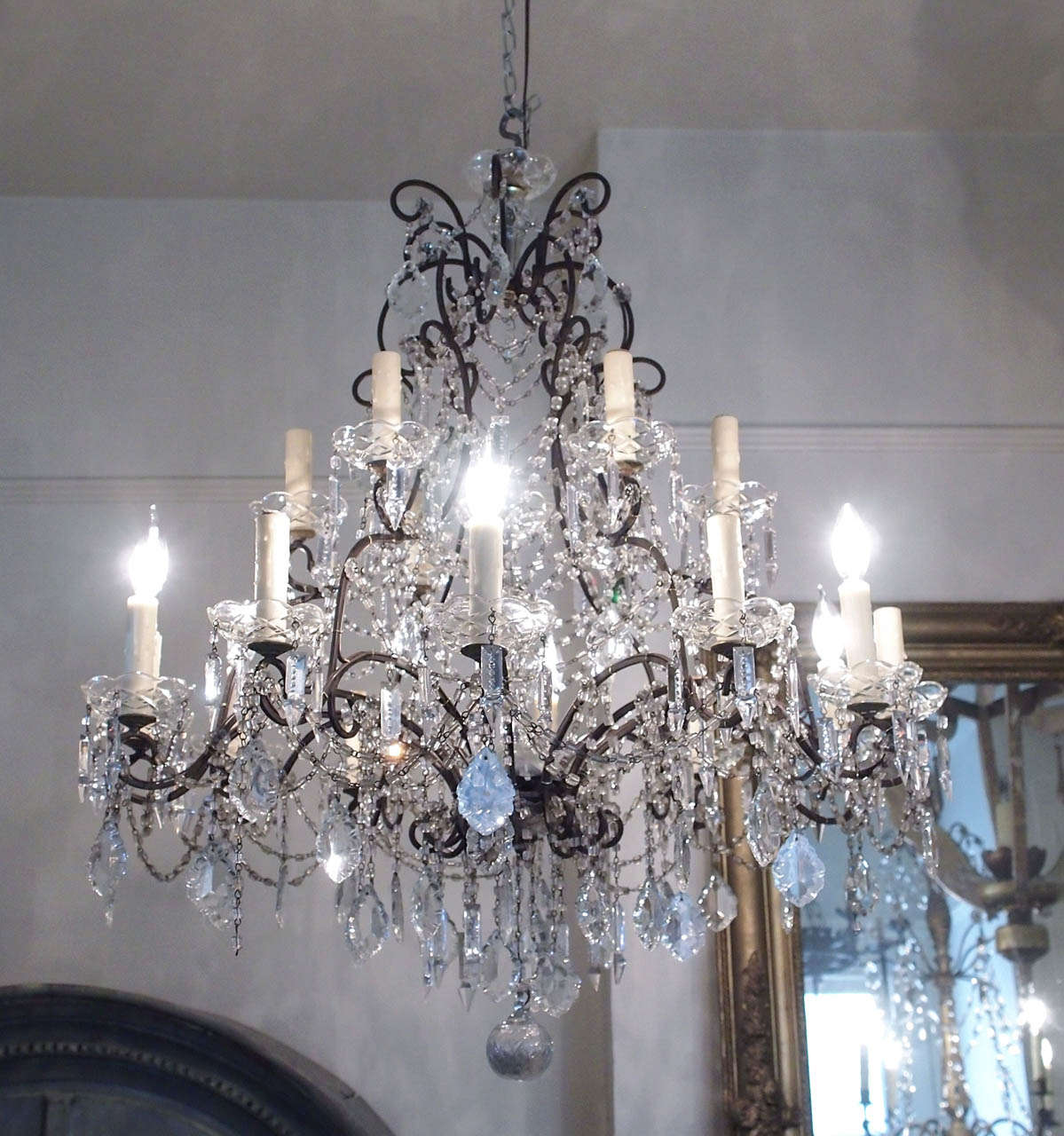 19th century Louis XV style chandelier with black iron and crystals. US wired