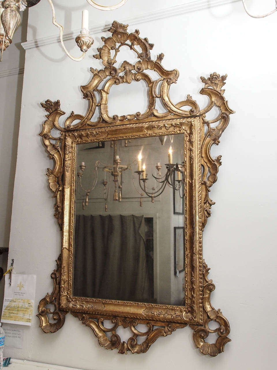 19th century Louis XV mirror with beautifully carved wood , all gilded and with flower motif.