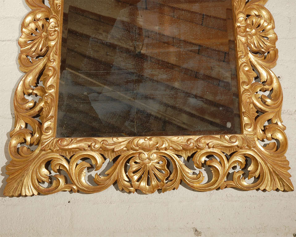 1920s French hand carved wood with 24k gold leaf finish mirror