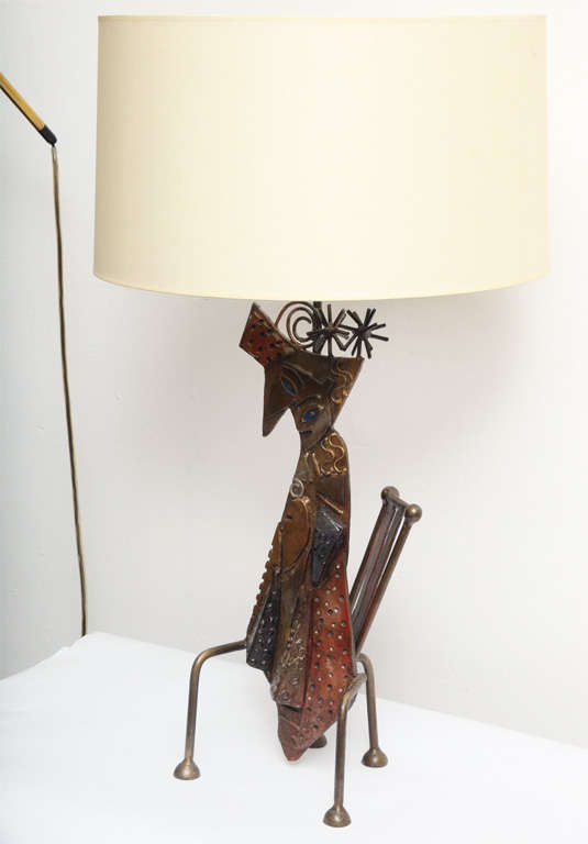 A handcrafted iron sculptural table lamp of cat on chair.
Shade not included