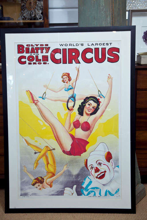 The colors really pop in this fun circus advertisement poster featuring flying acrobats and a circus clown. Produced by the Globe Poster Co. Professionally framed, in beautiful condition.