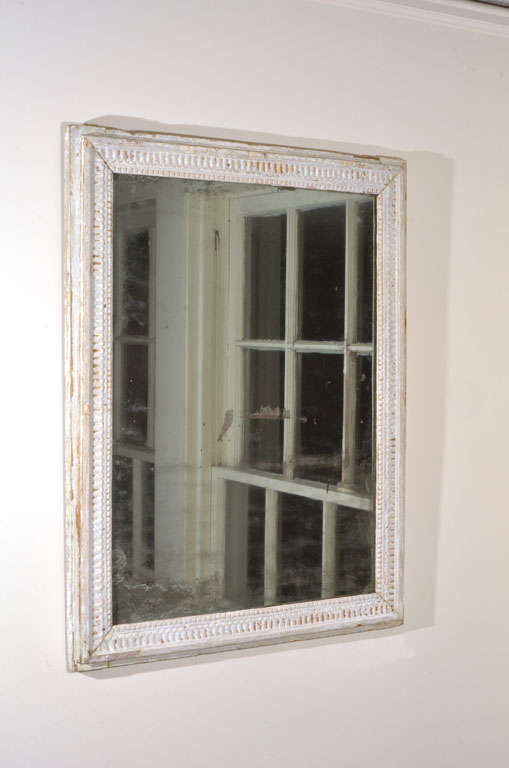 White carved mirror