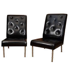Slipper chairs by Jacques Adnet