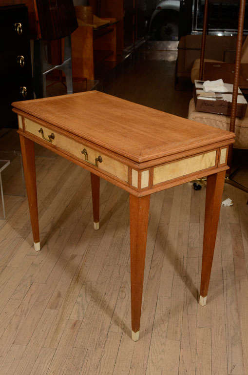 Cleverly designed flip-top console on oak, detailed in parchment and bone sabots. The top flip opens and is lined in felt. Open top: 35.5 x 35.5.
