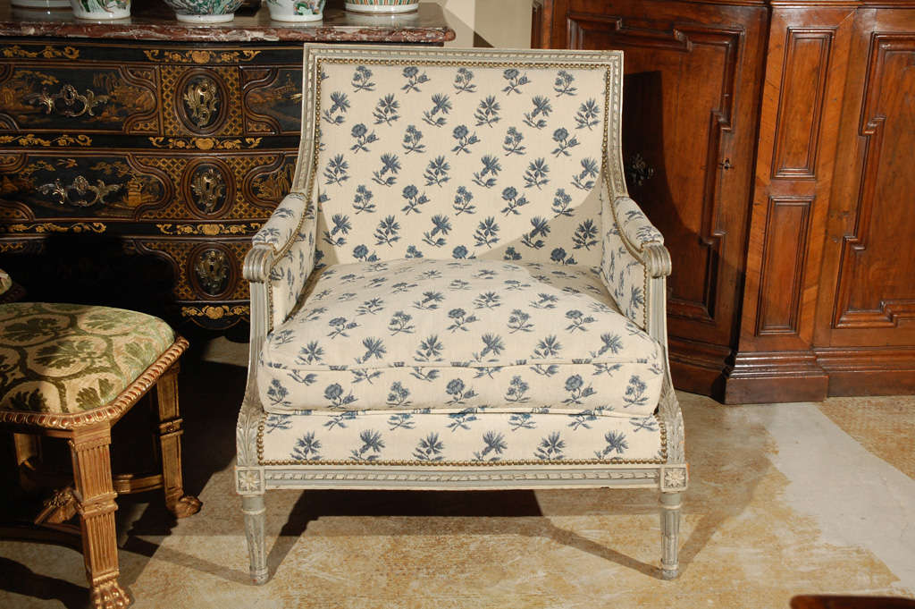 Hand-carved and painted, Louis XV style, French Marquis chair with bronze nailheads and acanthus leaves details.