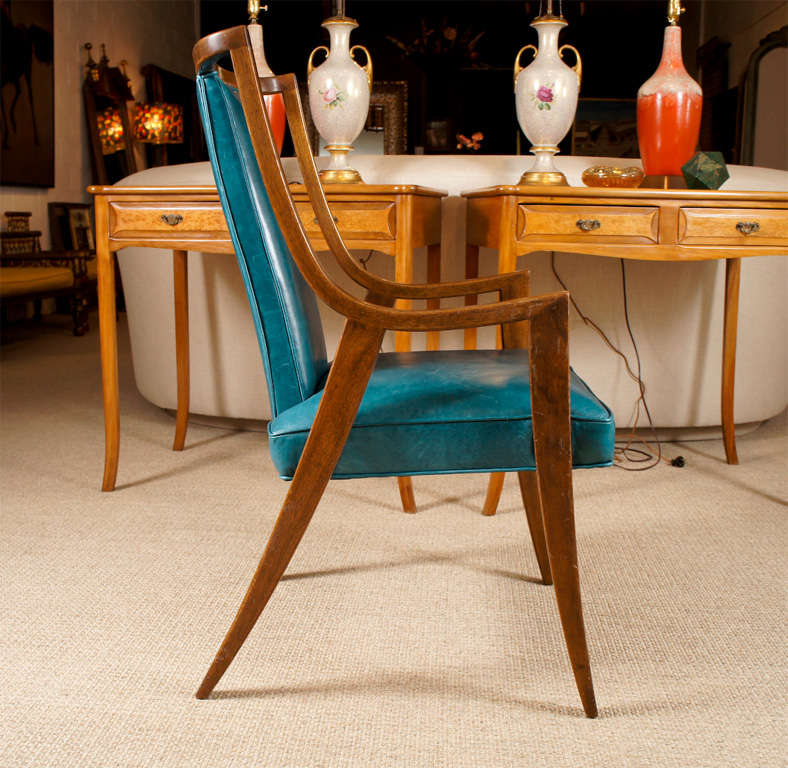 Here is a great modern arm chair in a walnut finish and a turquoise leather by Harvey Probber.