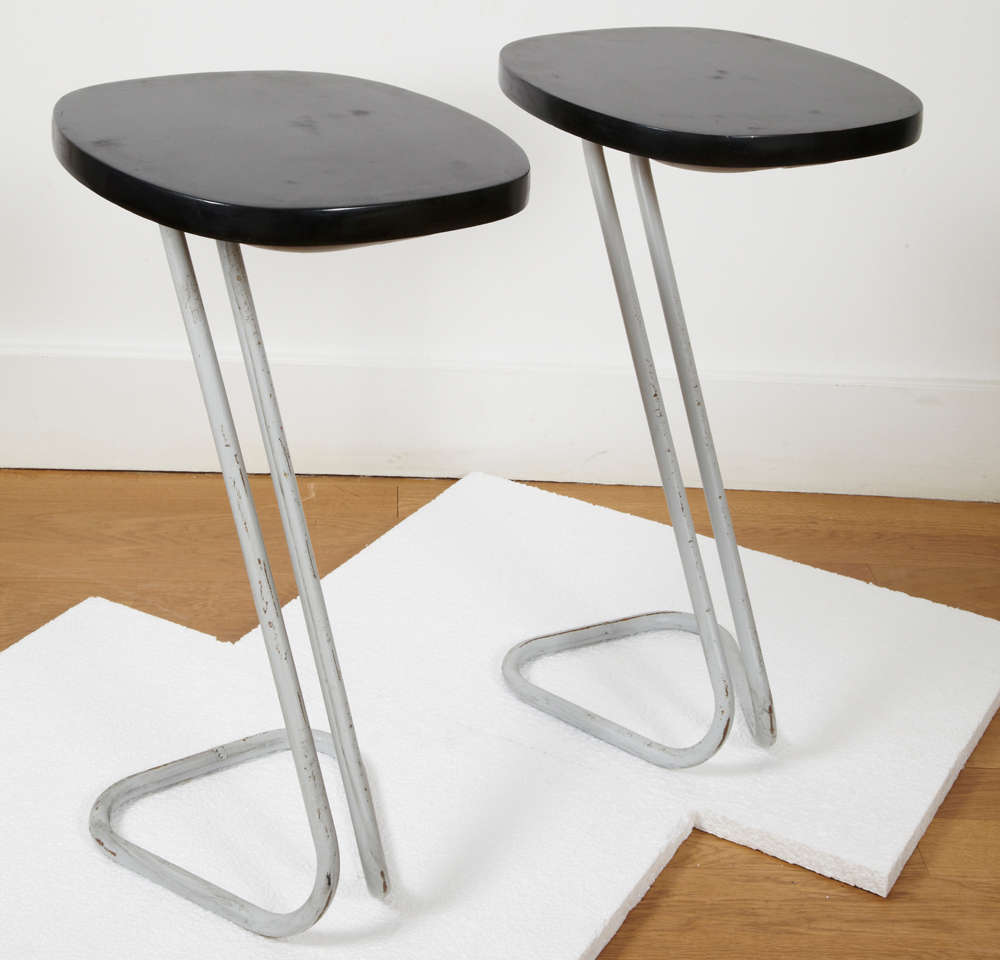 Pair of black lacquered wood side tables or sellettes, resting on a Z grey patinated tubular metal base. Stamped underneath.
There is a third red one.
André Bloc (1896-1966) French architect and designer, art magazines editor, created a few