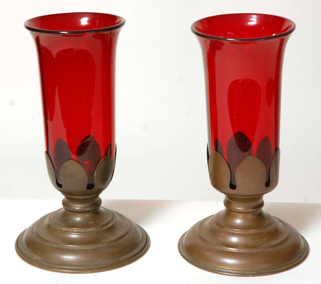 A nice pair of red glass vases in brass stands, circa 1910. Glass bowls are removable from the stands and are 5
