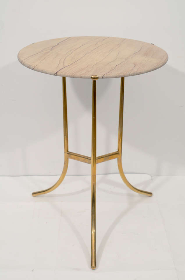 Exceptional pair of sandstone topped drinks tables with gilt brass bases, stamped Cedric Hartman.