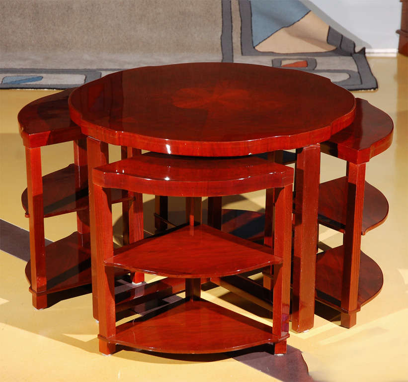 Art Deco lacquered round cocktail table with inlaid top and wedge inserts.