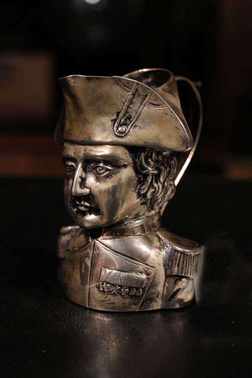 A well crafted figural silver creamer in the form of Napoleon.<br />
Fine quality chased work done in 800 grade silver.
