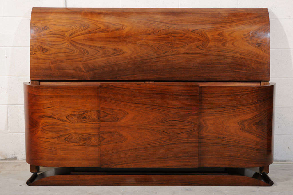 This is a stunning QUEEN size headboard & foot board from France.  It is made with beautiful book-matched rosewood veneers that flow across the headboard/foot board like nothing else.  It is rare to find a queen size Art deco bed.  Don't pass up on