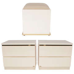 A pair of cabinets and a pouffe